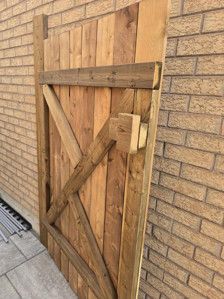 Wood fence gate under construction, unstained