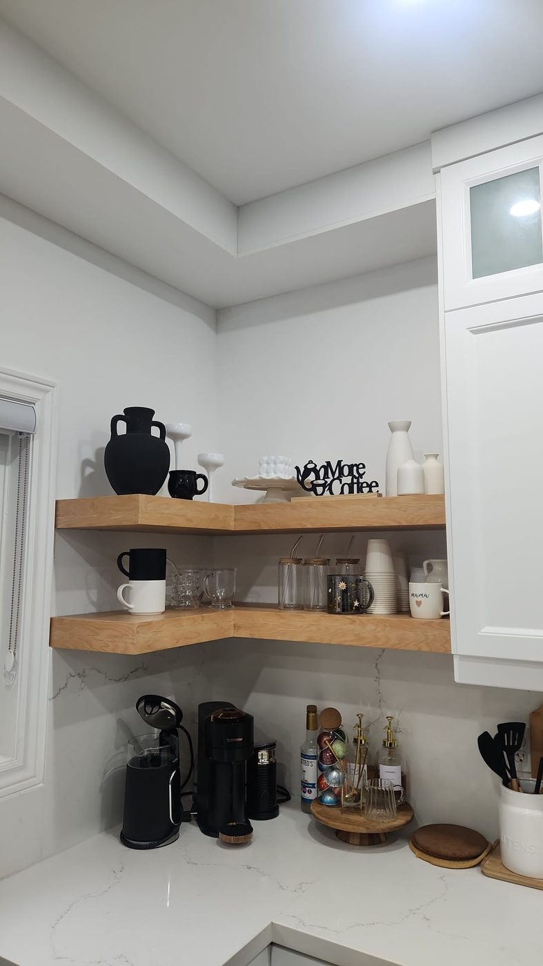 Custom floating corner shelves installed in kitchen