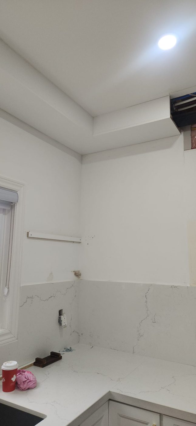 Empty kitchen corner before shelving installation