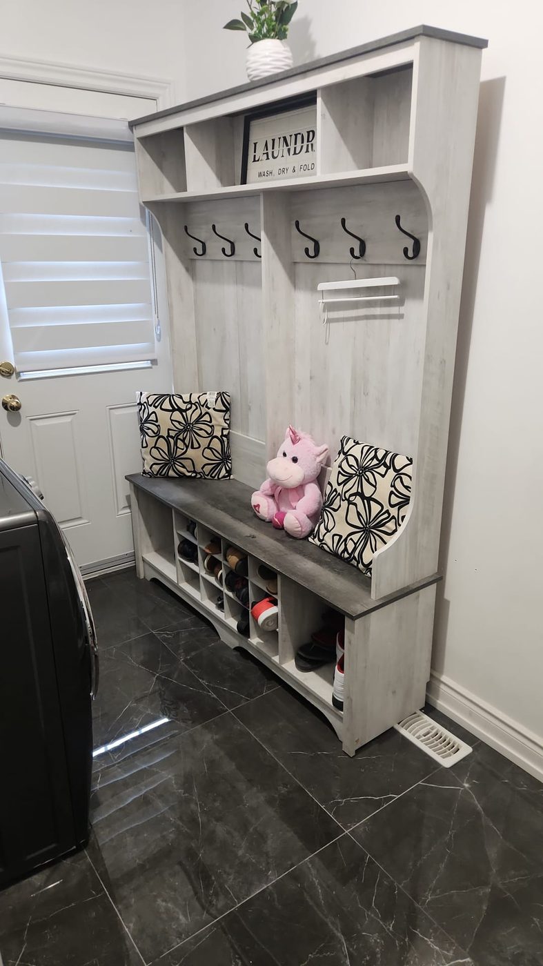 Finished mudroom with hall tree and shoe storage bench