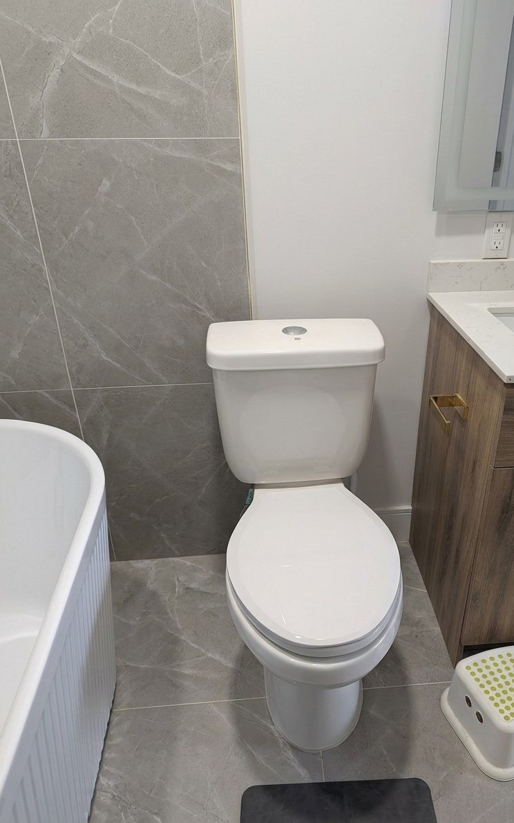 Newly installed toilet in renovated bathroom